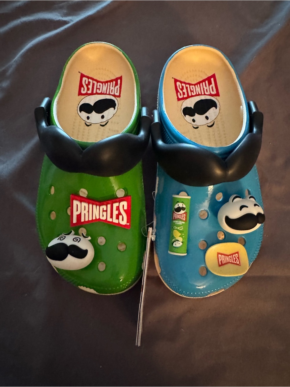 CROCS women’s SZ 7 Pringles 1 Green and 1 Blue